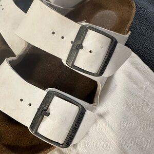 Birkenstock White Sandals with Adjustable Straps and Metal Buckles